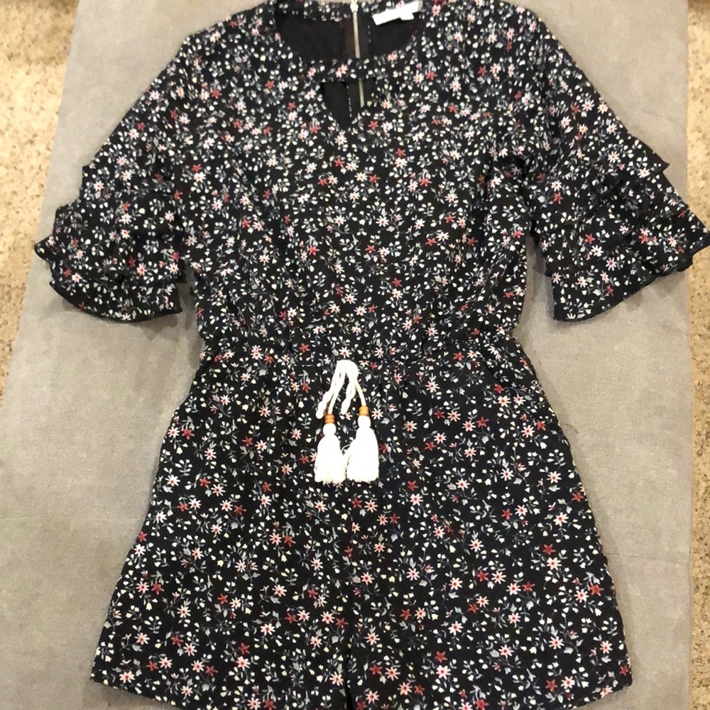 Boho tied front romper with shorts and side pockets.